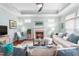 Bright living room with fireplace, ceiling fan, and a comfortable seating arrangement at 208 Abigail Ln, Gibsonville, NC 27249