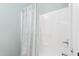 Contemporary shower with a patterned curtain, offering a clean and stylish bathing space at 208 Abigail Ln, Gibsonville, NC 27249