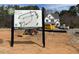 Community map showcasing the new phase release, homesites and location, with a home in the background at 2313 Eagle Shot Ct # 29, Fuquay Varina, NC 27526