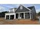 Stunning two-story home with a two-car garage, covered entry, and modern design accents at 2313 Eagle Shot Ct # 29, Fuquay Varina, NC 27526