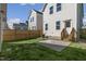 A lush backyard enclosed with a wooden fence and featuring a concrete patio at 237 Daniel Ridge Rd, Wendell, NC 27591
