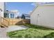 A well manicured backyard shows a stone patio and the home's door and exterior at 237 Daniel Ridge Rd, Wendell, NC 27591