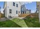 Spacious backyard showcases green lawn, fence, and access to the home's rear entrance at 237 Daniel Ridge Rd, Wendell, NC 27591