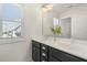 Bathroom featuring double vanity, modern lighting, and large window at 237 Daniel Ridge Rd, Wendell, NC 27591