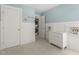 Bedroom with pale blue walls and white trim, and a laundry closet at 237 Daniel Ridge Rd, Wendell, NC 27591