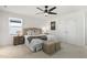 Bright bedroom features a plush bed, neutral tones, and modern ceiling fan at 237 Daniel Ridge Rd, Wendell, NC 27591