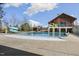 Community pool with waterslide and adjacent clubhouse for recreation and relaxation at 237 Daniel Ridge Rd, Wendell, NC 27591