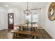 Bright dining room featuring a rustic wood table set and natural light from the windows at 237 Daniel Ridge Rd, Wendell, NC 27591