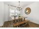 Sunlit dining room featuring a wood table, bench, and decor, creating an inviting atmosphere at 237 Daniel Ridge Rd, Wendell, NC 27591