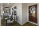 Cozy front porch with seating, featuring a charming wreath on the wood door and a welcome mat at 237 Daniel Ridge Rd, Wendell, NC 27591