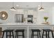 Bright kitchen featuring an island with a white countertop and bar seating, stainless steel appliances, and pendant lighting at 237 Daniel Ridge Rd, Wendell, NC 27591