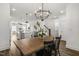Open-concept space with a dining area, kitchen island with seating, and modern decor at 237 Daniel Ridge Rd, Wendell, NC 27591