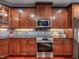 Updated kitchen featuring stainless steel appliances, custom cabinetry, and subway tile backsplash at 24 Mountain Laurel, Chapel Hill, NC 27517