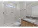 Bright bathroom with a marble tiled shower and modern vanity at 25 Arbor Dr, Youngsville, NC 27596