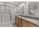 Bathroom showcasing double vanity and glass shower at 25 Arbor Dr, Youngsville, NC 27596