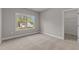 Bedroom with plush carpeting and view of neighborhood at 25 Arbor Dr, Youngsville, NC 27596