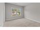 Bedroom with plush carpeting and view of neighborhood at 25 Arbor Dr, Youngsville, NC 27596