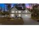 Charming two-story home with a well-maintained lawn and attached two-car garage at 25 Arbor Dr, Youngsville, NC 27596