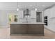 Modern kitchen featuring a center island, stainless steel appliances, and ample cabinet space at 25 Arbor Dr, Youngsville, NC 27596