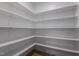 Walk-in pantry with multiple shelves for ample storage at 25 Arbor Dr, Youngsville, NC 27596