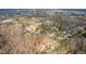 An aerial view of a home surrounded by trees, showcasing its peaceful location at 260 Culbreth Rd, Chapel Hill, NC 27516