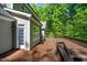 A wooden deck featuring a gray exterior and a door, offering great outdoor living space at 260 Culbreth Rd, Chapel Hill, NC 27516