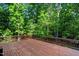 Inviting backyard deck offering stunning views of the surrounding lush green trees at 260 Culbreth Rd, Chapel Hill, NC 27516
