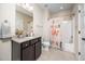 Clean bathroom with granite countertops, modern fixtures, and colorful shower curtain at 260 Culbreth Rd, Chapel Hill, NC 27516
