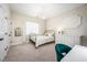 Cozy bedroom with a decorative chandelier, lots of natural light, and neutral decor at 260 Culbreth Rd, Chapel Hill, NC 27516
