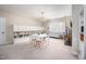 Bright bonus room features built-in shelving, a cozy sitting area, and a playful chandelier at 260 Culbreth Rd, Chapel Hill, NC 27516
