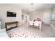Expansive bonus room featuring a colorful rug, television, and ample space for activities at 260 Culbreth Rd, Chapel Hill, NC 27516