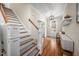 Traditional entryway with stairs, hardwood floors, light walls and front door with sidelights at 260 Culbreth Rd, Chapel Hill, NC 27516