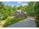 Charming two-story home with a well-manicured lawn, mature trees and an elongated drive way at 260 Culbreth Rd, Chapel Hill, NC 27516