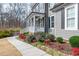 Charming home featuring manicured landscaping, a sidewalk and a welcoming front porch at 260 Culbreth Rd, Chapel Hill, NC 27516