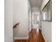 Hardwood hallway with natural lighting leads to bedrooms and bathrooms at 260 Culbreth Rd, Chapel Hill, NC 27516