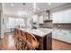 A spacious kitchen featuring a large island with seating, granite countertops, and stainless steel appliances at 260 Culbreth Rd, Chapel Hill, NC 27516