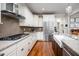 Gourmet kitchen featuring stainless steel appliances, custom cabinets, and hardwood floors at 260 Culbreth Rd, Chapel Hill, NC 27516