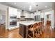 Gourmet kitchen with stainless steel appliances, granite countertops, island, and breakfast bar at 260 Culbreth Rd, Chapel Hill, NC 27516