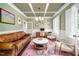 Cozy living room featuring a comfortable leather couch and stylish decor at 260 Culbreth Rd, Chapel Hill, NC 27516