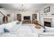 Bright living room with fireplace, hardwood floors, ample seating and custom built-ins at 260 Culbreth Rd, Chapel Hill, NC 27516