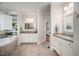 Elegant main bathroom features double vanities, a corner soaking tub, and neutral tile flooring at 260 Culbreth Rd, Chapel Hill, NC 27516