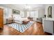 Bright main bedroom features hardwood floors, a blue patterned rug, and tray ceiling at 260 Culbreth Rd, Chapel Hill, NC 27516