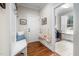 Practical mud room entry with built-in bench, coat hooks, and access to laundry room at 260 Culbreth Rd, Chapel Hill, NC 27516