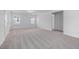 Light filled bedroom with large closet and neutral carpet and paint at 2826 Huxley Way, Apex, NC 27502
