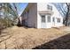 Exterior of home with view of back patio and grassy lawn at 307 Gordon St, Roxboro, NC 27573