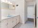 Vintage bathroom with light blue sink and cabinets and mosaic tile floor at 307 Gordon St, Roxboro, NC 27573