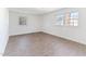 Spacious bedroom features hardwood floors and two windows for natural light at 307 Gordon St, Roxboro, NC 27573