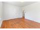 Bedroom showcasing hardwood floors, neutral walls, and access to an ensuite bathroom at 307 Gordon St, Roxboro, NC 27573