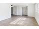 White bedroom with two doors and neutral paint showcases the modern wood flooring at 307 Gordon St, Roxboro, NC 27573