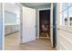 Entryway featuring wood floors and view of the elevator with blue wood accent wall at 307 Gordon St, Roxboro, NC 27573